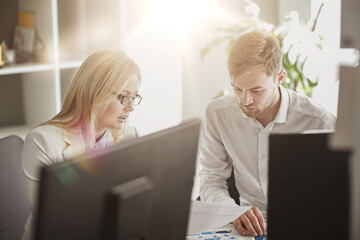 business team discussing papers at office table