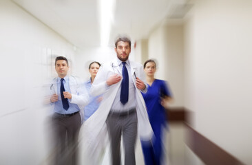 group of medics walking along hospital