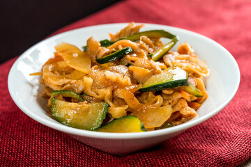 wok fried chicken stir fry with sweet peppers and chinese vegetables