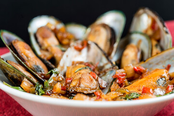 Mussel with white wine sauce on table