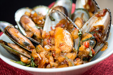 Mussel with white wine sauce on table