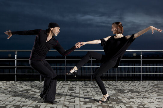 Senior Couple Ballroom Dancing On Dark Sunset