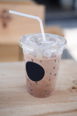 Ice coffee on a wooden table