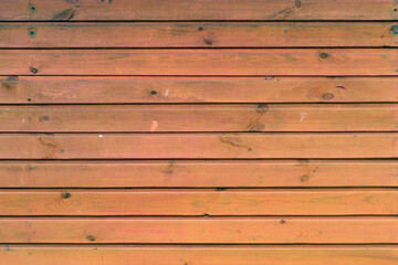 Red wall of wooden boards