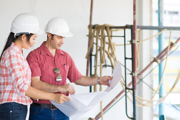 Multiethnic professional construction engineers working with Corporate Colleagues Teamwork and equipment blueprint at the building site place, Industrial engineering Concept