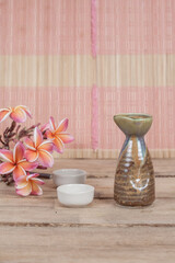 vintage sake bottle on wood