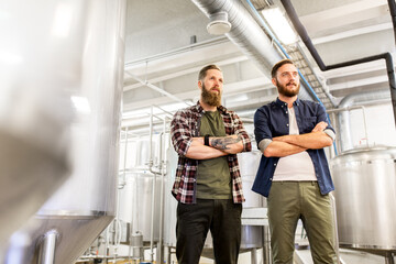 men at craft brewery or beer plant