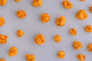 Yellow crumpled paper balls