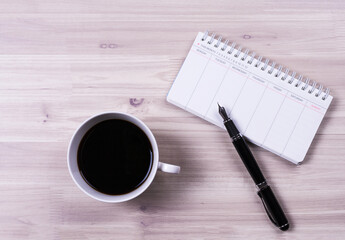 Coffee, scheduler and fountain pen