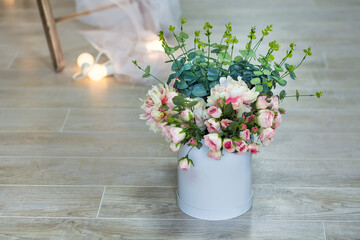 Bouquet of white jasmine flowers in a vase. Romantic floral still life with white jasmine flowers and petals. Mock orange jasmine - Philadephus flowers. Home flower decoration.