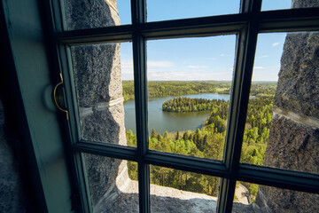 Landscape view  through a window at Aulanko lookout tower  in Finland.