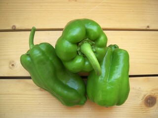 Green sweet pepper on the wooden rustic table,.......