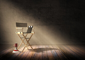 Obraz premium Director's chair with clapper board and megaphone in dark room scene with spotlight light, 3D rendering
