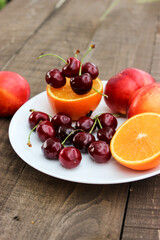 Fototapeta na wymiar Juicy cherries, luscious nectarine