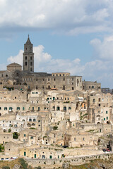 Fototapeta na wymiar Matera, Italy - May 20 2017: Panoramic view of the city from the belvedere square with background the clouds in the sky