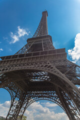 eifel tower bottom view with cloud sky on background in spring