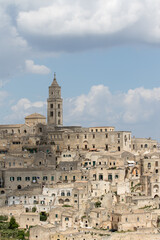 Obraz premium Matera, Italy - May 20 2017: Panoramic view of the city from the belvedere square with background the clouds in the sky
