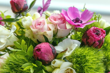 Large beautiful bouquet of peonies, roses, anemones in a vase