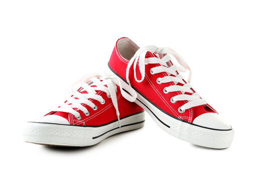 Pair Of Red Sneakers Isolated On A White