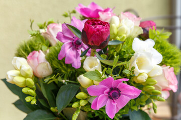 Large beautiful bouquet of peonies, roses, anemones in a vase