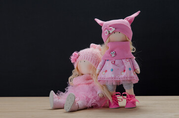 beautiful handmade dolls on a gray background