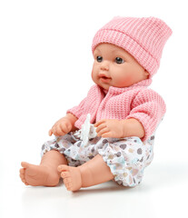 Toy doll child, in pink blouse with pacifier on isolated background