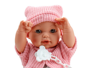 Toy doll child, in pink blouse with pacifier on isolated background