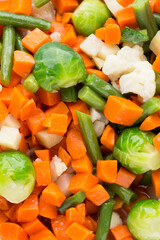Fresh vegetables mix in a white bowl.