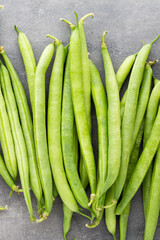 Green beans  on a gray background.