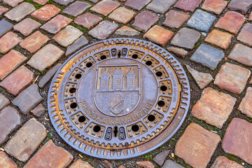 Manhole on the pavement in Prague