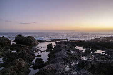 Sunset on volcanic rock pools Tenerife