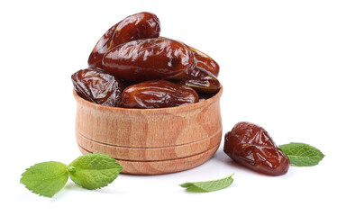 date fruit in wooden bowl isolated on white background