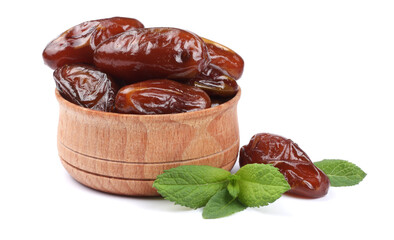 date fruit in wooden bowl isolated on white background