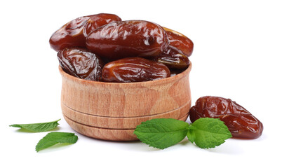 date fruit in wooden bowl isolated on white background
