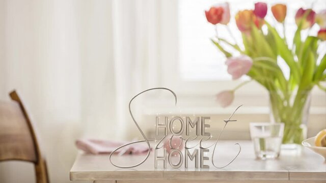 Homey table top with stars creating the words home sweet home loopable