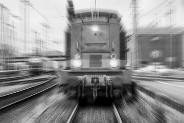 train speeding black and white