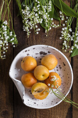 Fresh apricots on wooden table