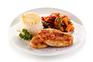 Roast chicken filet with rice and vegetables on white background