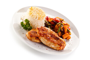 Roast chicken filet with rice and vegetables on white background