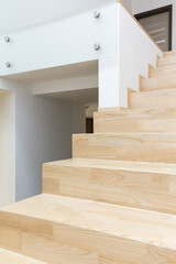Minimalist hallway and wooden stairs
