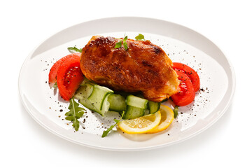 Grilled chicken fillet with vegetables on white background