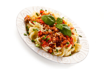 Pasta with meat and tomato sauce on white background