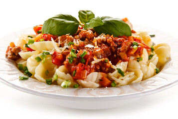 Pasta with meat and tomato sauce on white background