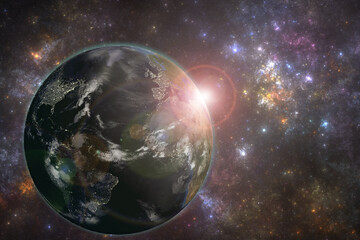 Planet Earth with night city lights and rising sun. Elements of this image furnished by NASA