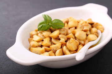 Mushrooms in mustard marinade, black background