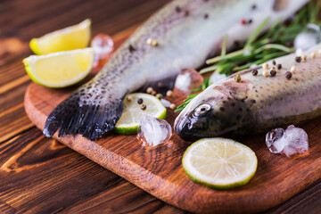 Seafood. Two raw rainbow trouts marinated with lime, rosemary