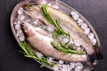 Seafood. Two raw rainbow trouts marinated with lime, rosemary