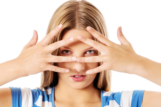 Woman covering her face with hands.