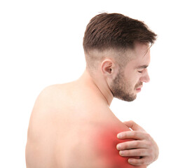 Fototapeta premium Young man suffering from pain in shoulder on white background