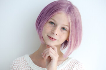 Lilac color for trendy hairstyle ideas. Girl with dyed hair on light background